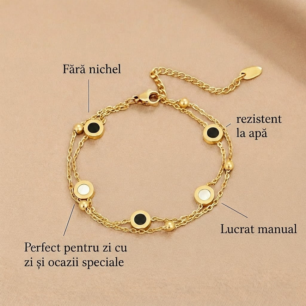 Carla – Brățară moale din aur cu elemente rotunde umplute în contrast.